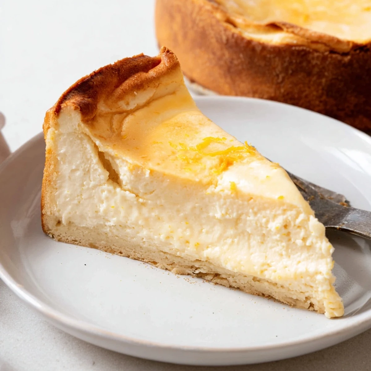 A beautifully baked German cheesecake, with a hint of lemon, perfect for dessert enjoyment.
