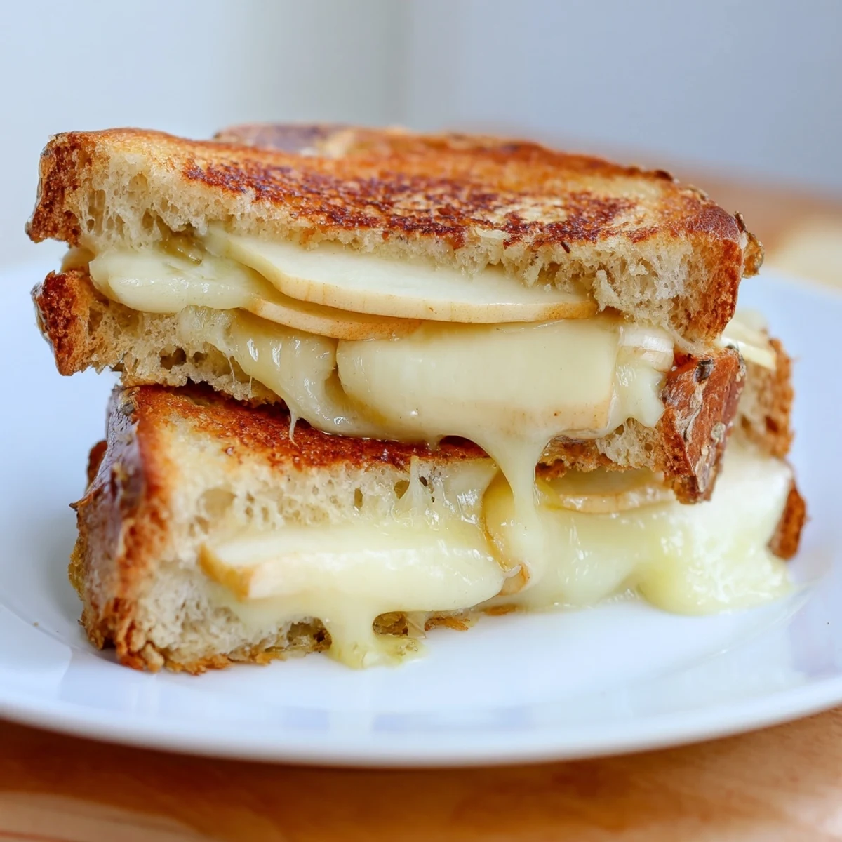 Crisp apple slices and creamy Brie in a Brie and Apple Grilled Cheese, perfectly grilled.