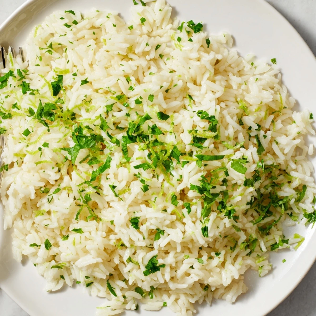 Close-up of vibrant cilantro lime rice, showing fluffy grains and buttery richness.
