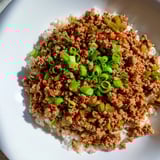 Close-up of savory Cajun Dirty Rice, a flavorful rice dish with colorful vegetables.