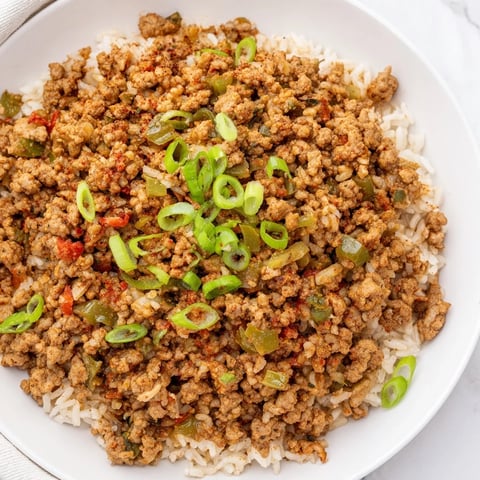 Fragrant Cajun Dirty Rice, a hearty Southern meal, simmered with ground meat and spices.