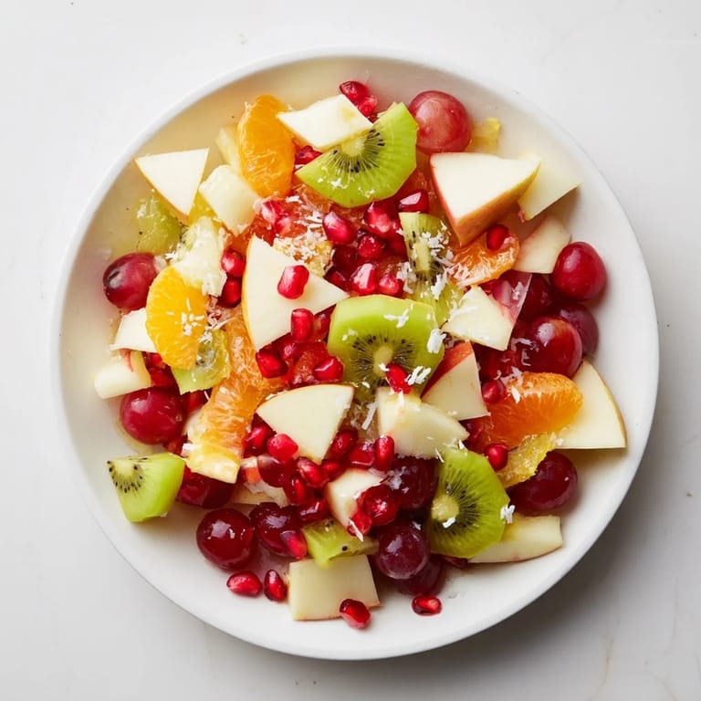 Close-up of a Snowflake Fruit Medley showcasing fresh fruit segments and a light citrus glaze.